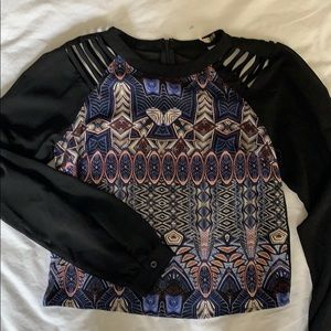 Patterned blouse with shoulder cutouts